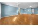 Spacious living room featuring hardwood floors, ceiling fans, neutral wall paint and plenty of space at 8655 Sw 98Th Street Rd # G, Ocala, FL 34481