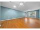 Spacious living room featuring hardwood floors, ceiling fans, neutral wall paint and lots of natural light at 8655 Sw 98Th Street Rd # G, Ocala, FL 34481