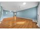Open-concept living room with natural light, wood floors and a neutral color scheme at 8655 Sw 98Th Street Rd # G, Ocala, FL 34481