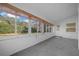 Bright sunroom with large windows providing views of the outdoors at 8655 Sw 98Th Street Rd # G, Ocala, FL 34481