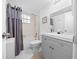 Bathroom featuring a shower-tub combo, modern vanity, and neutral finishes at 567 Midway Trak # H102, Ocala, FL 34472