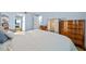 Bedroom with a double bed and wooden dresser at 567 Midway Trak # H102, Ocala, FL 34472