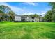 Building exterior with lush landscaping at 567 Midway Trak # H102, Ocala, FL 34472