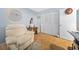 Office space with comfortable chair, desk, and closet storage at 567 Midway Trak # H102, Ocala, FL 34472