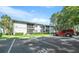 Parking lot with building and green space in background at 567 Midway Trak # H102, Ocala, FL 34472