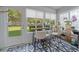 Sunroom with table, chairs, and access to yard at 567 Midway Trak # H102, Ocala, FL 34472