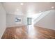 Bright living room with hardwood floors and shiplap wall at 11749 Sw 57Th Ter, Ocala, FL 34476