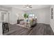 Living room with sofa, sitting area and view into kitchen and dining area at 16612 Sw 31St Cir, Ocala, FL 34473