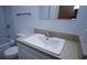 Bathroom features a vanity with sink and a toilet at 11001 Se Sunset Harbor Rd # A08, Summerfield, FL 34491