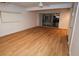 Bright living room featuring wood-look floors and sliding glass doors at 11001 Se Sunset Harbor Rd # A08, Summerfield, FL 34491