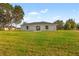 Spacious backyard with a large grassy area at 17273 Sw 20Th Court Rd, Ocala, FL 34473