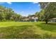 Spacious backyard with home, shed and screened in pool with slide for outdoor enjoyment at 15235 Se 63Rd Ave, Summerfield, FL 34491