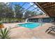 Enjoy the screened pool with slide and diving board, ideal for summer fun and relaxation at 15235 Se 63Rd Ave, Summerfield, FL 34491