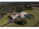 Aerial view of a luxurious home, pool, and expansive grounds at 3440 Sw 66Th St, Ocala, FL 34476