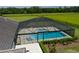 Aerial view of a large, screened-in pool with a spa at 3440 Sw 66Th St, Ocala, FL 34476