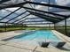 Resort-style pool and spa with screened enclosure and open views at 3440 Sw 66Th St, Ocala, FL 34476