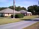 Community building with landscaping and flag at 10926 Sw 78Th Ct, Ocala, FL 34476