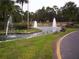 Pond with water fountains and palm trees at 10926 Sw 78Th Ct, Ocala, FL 34476