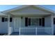 A charming porch featuring a white picket fence that welcomes you home at 10926 Sw 78Th Ct, Ocala, FL 34476