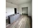 Modern kitchen with gray cabinets and wood-look flooring at 35 Locust Terrace Way, Ocala, FL 34472