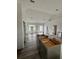 Modern kitchen with gray cabinets and wood-look flooring at 35 Locust Terrace Way, Ocala, FL 34472