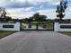 Silverleaf Hills gated entrance to an expansive property with lush greenery and mature trees, offering privacy and exclusivity at 6615 Se 158Th Pl # 6, Summerfield, FL 34491