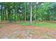 Wooden fence and metal gate entrance to the property at 5894 Ne 43Rd Lane Rd, Silver Springs, FL 34488