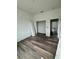 Unfinished bedroom with wood-look flooring and built-in closet at 5394 Nw 6Th Pl, Ocala, FL 34482