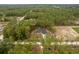 Aerial view of a home in a serene, wooded area, showcasing its peaceful and private setting at 4444 Sw 118 Ter, Ocala, FL 34481