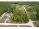 Aerial view of a cozy home nestled among tall trees in a quiet neighborhood at 4444 Sw 118 Ter, Ocala, FL 34481