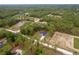 Expansive aerial view of a secluded property surrounded by a lush forest landscape at 4444 Sw 118 Ter, Ocala, FL 34481