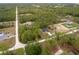 Beautiful aerial showing a home with a long drive and surrounding dense woods at 4444 Sw 118 Ter, Ocala, FL 34481