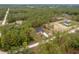 Aerial view of a newly constructed home surrounded by lush greenery and natural landscape at 4444 Sw 118 Ter, Ocala, FL 34481