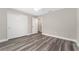 Bright bedroom features wood-look flooring, neutral paint and ample closet space at 4444 Sw 118 Ter, Ocala, FL 34481