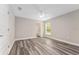 This light-filled bedroom has vinyl floors and a view from the window at 4444 Sw 118 Ter, Ocala, FL 34481