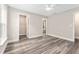 Spacious bedroom features new flooring, large windows, and modern fan at 4444 Sw 118 Ter, Ocala, FL 34481