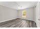Cozy bedroom with large window and ceiling fan at 4444 Sw 118 Ter, Ocala, FL 34481