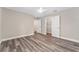 Spacious bedroom with modern flooring, ceiling fan, and roomy closet at 4444 Sw 118 Ter, Ocala, FL 34481
