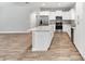 Bright kitchen with white cabinets and a large kitchen island at 4444 Sw 118 Ter, Ocala, FL 34481