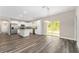 Modern kitchen with stainless steel appliances, white cabinetry, and a center island at 4444 Sw 118 Ter, Ocala, FL 34481
