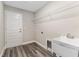 Functional laundry room featuring sink, utility hookups, and exterior access at 4444 Sw 118 Ter, Ocala, FL 34481