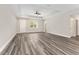 Bright and airy open living area with hardwood floors and a ceiling fan at 4444 Sw 118 Ter, Ocala, FL 34481