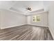 Open living area with hardwood floors, and a ceiling fan at 4444 Sw 118 Ter, Ocala, FL 34481