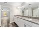 Spacious bathroom featuring double vanity and granite countertops at 4444 Sw 118 Ter, Ocala, FL 34481