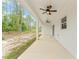 Covered patio with ceiling fans showcasing the outdoor living space of the home at 4444 Sw 118 Ter, Ocala, FL 34481