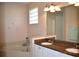 Elegant bathroom with double sinks, granite countertop, and a large soaking tub at 8345 Sw 82Nd Loop, Ocala, FL 34481