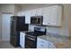 Kitchen with stainless steel appliances and granite countertops at 8345 Sw 82Nd Loop, Ocala, FL 34481