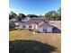 Single-story home with brown roof, landscaped yard, and driveway at 352 Marion Oaks Ln, Ocala, FL 34473