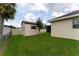 Tan shed with dark brown trim nestled in a green backyard at 352 Marion Oaks Ln, Ocala, FL 34473