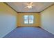 Spacious bedroom with carpeted floors and ceiling fan at 352 Marion Oaks Ln, Ocala, FL 34473